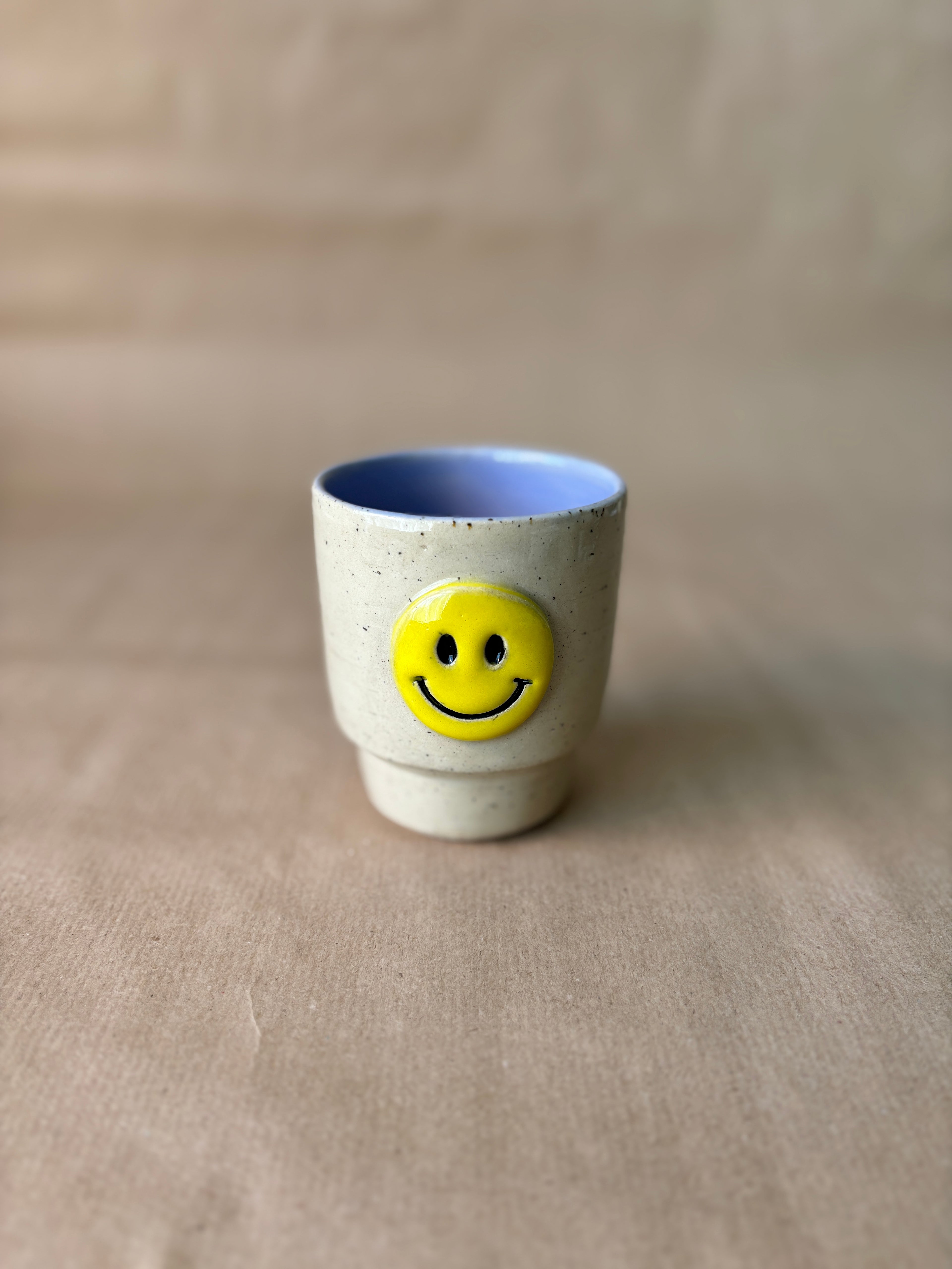 Smiley face stapel cup lila
