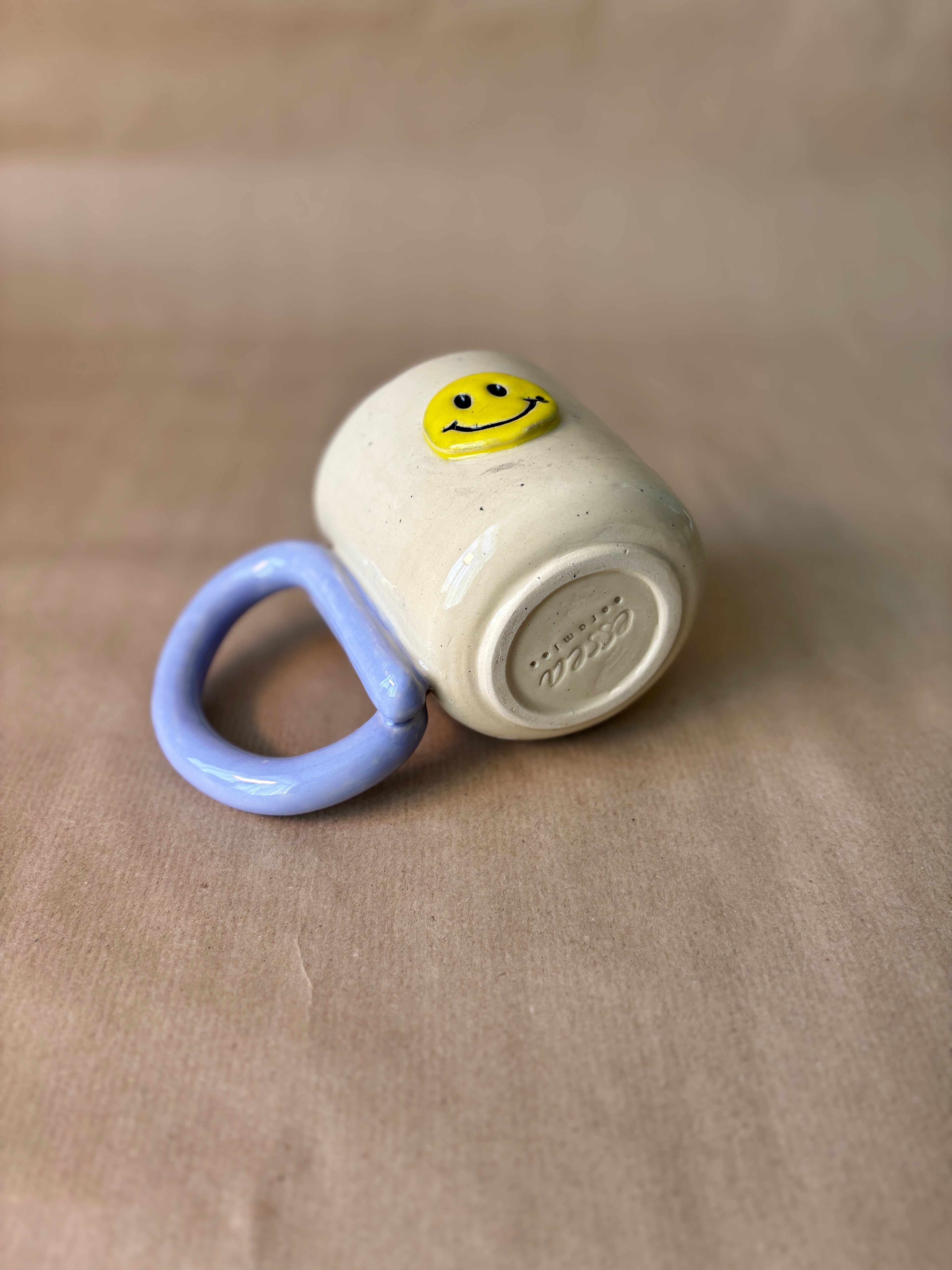Smiley face mok lila/turqoise